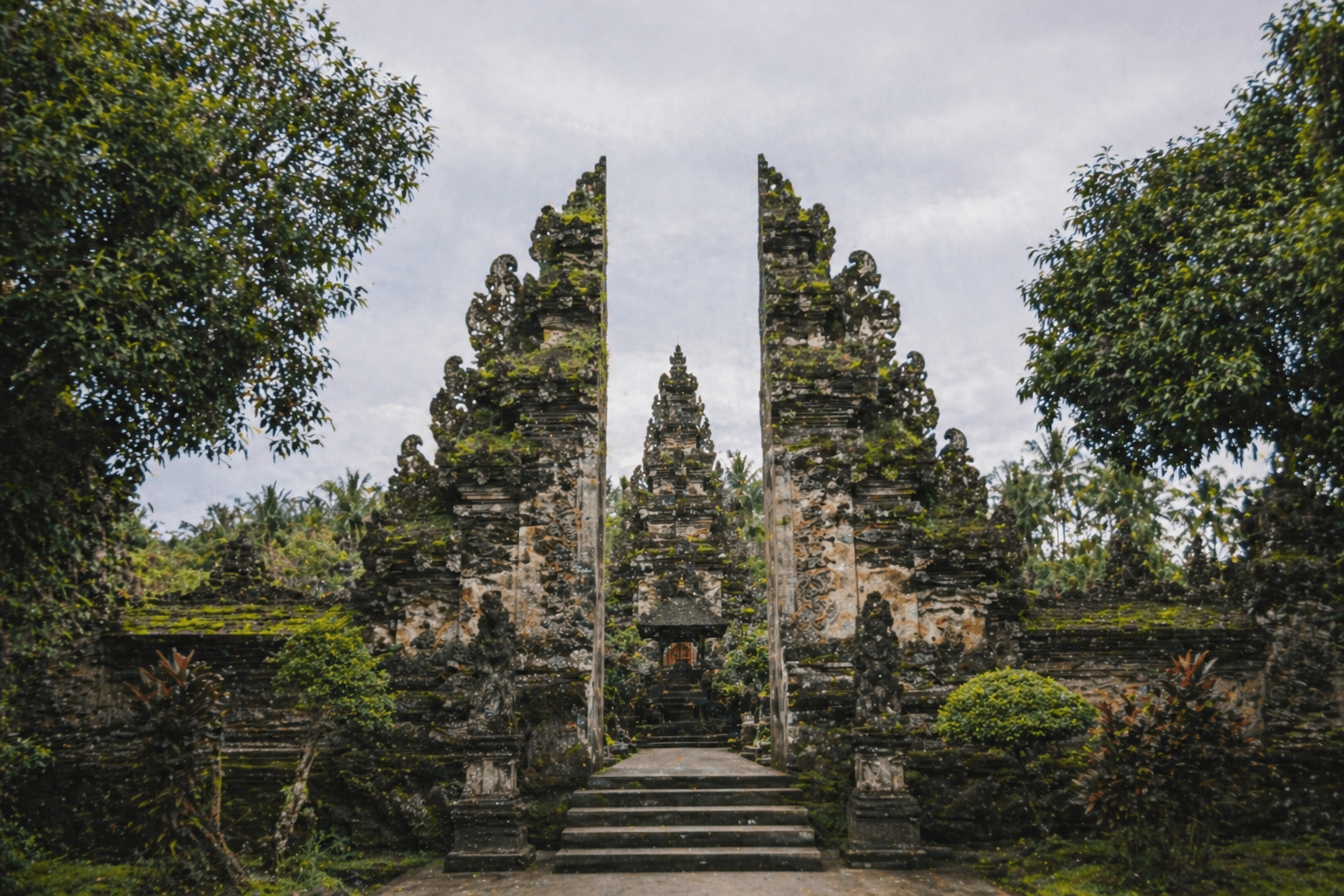 Ancient Balinese temple surrounded by lush jungle